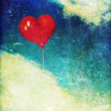 Vintage photo of red heart balloon in the sky